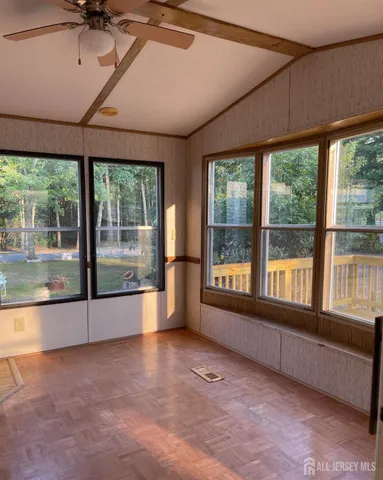 a view of an empty room with a large window