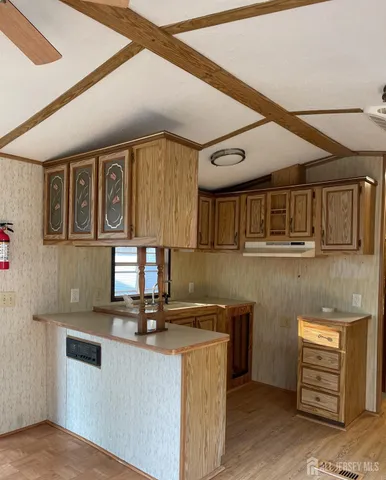 a kitchen with stainless steel appliances granite countertop a sink and cabinets