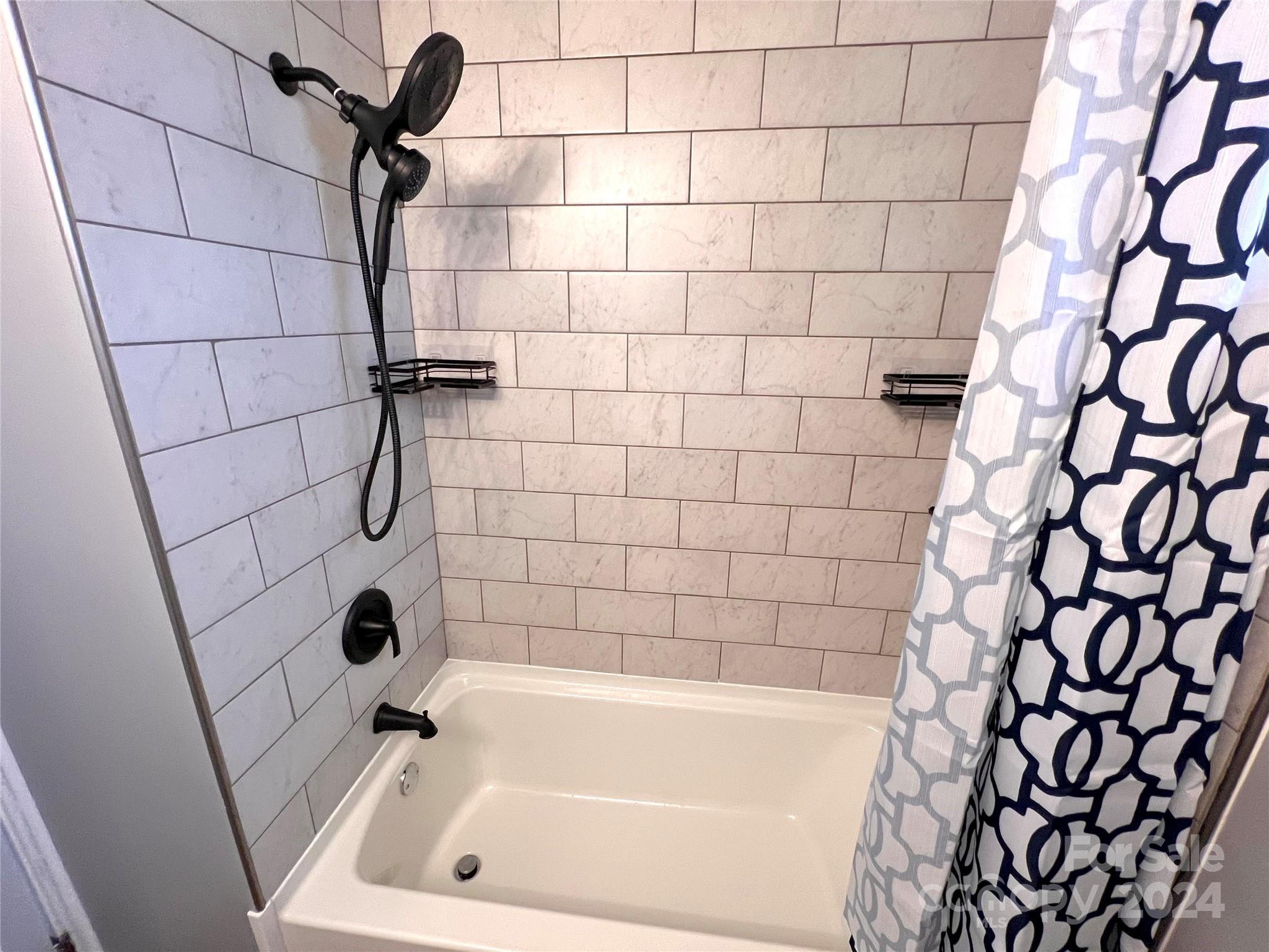 461 Chimney Rock Road Rutherfordton, NC 28139 - Photo 26 of 39 a bathroom with a bathtub