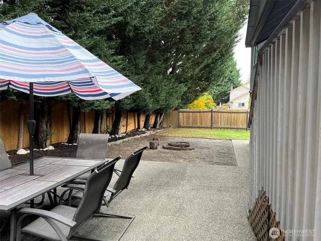 a view of a chairs and table in the patio
