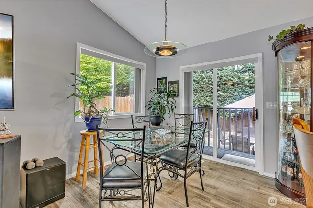 a view of a dining room with furniture window and outside view