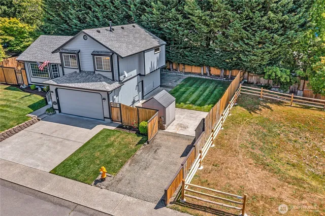 a aerial view of a house with a yard