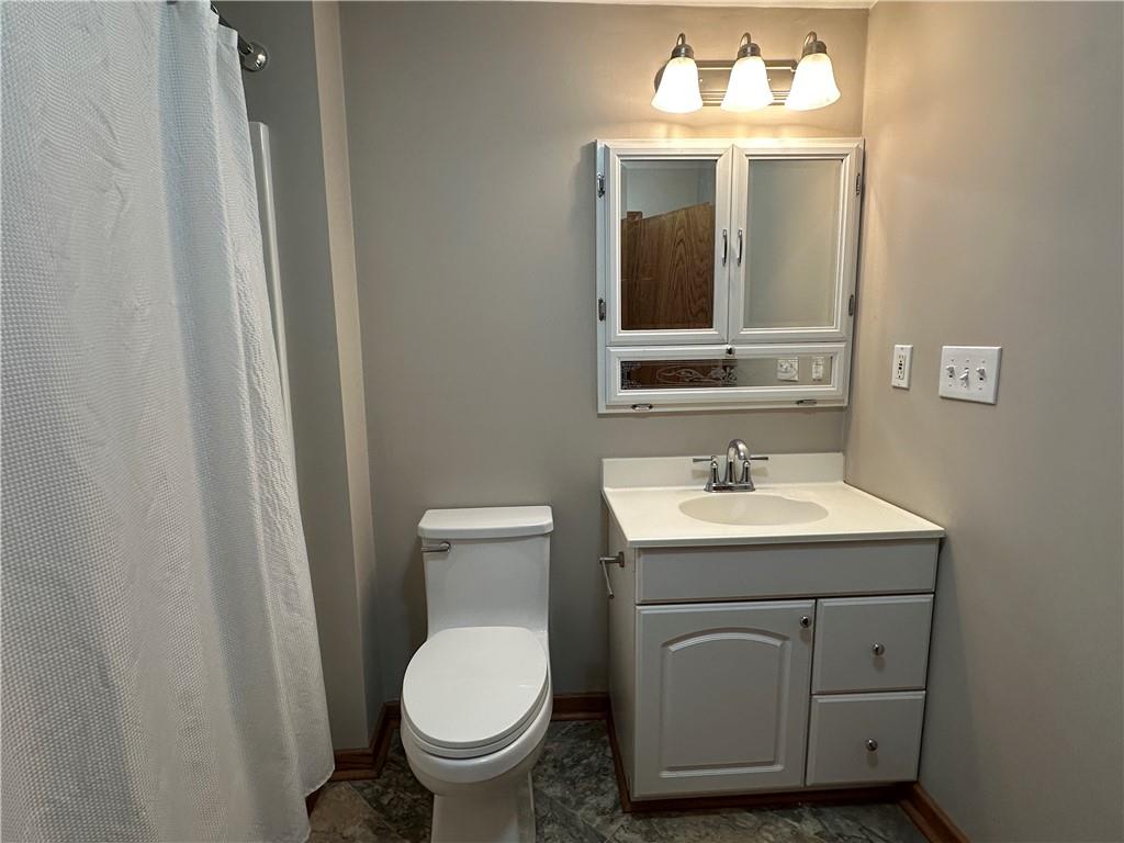 710 Spiva Road Temple, GA 30179 - Photo 21 of 31 a bathroom with a toilet sink and mirror