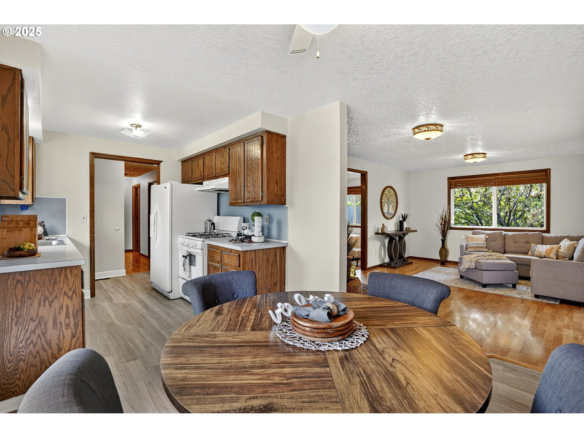 1427 Southeast Wendy Avenue Gresham, OR 97080 - Photo 14 of 35 a living room with furniture kitchen view and a window