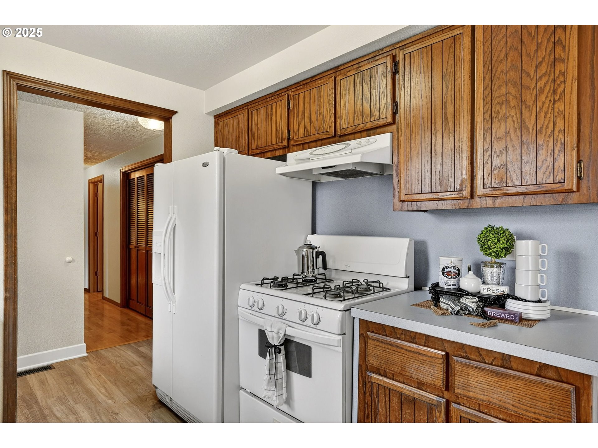 1427 Southeast Wendy Avenue Gresham, OR 97080 - Photo 16 of 35 a kitchen with stainless steel appliances granite countertop a refrigerator stove and sink