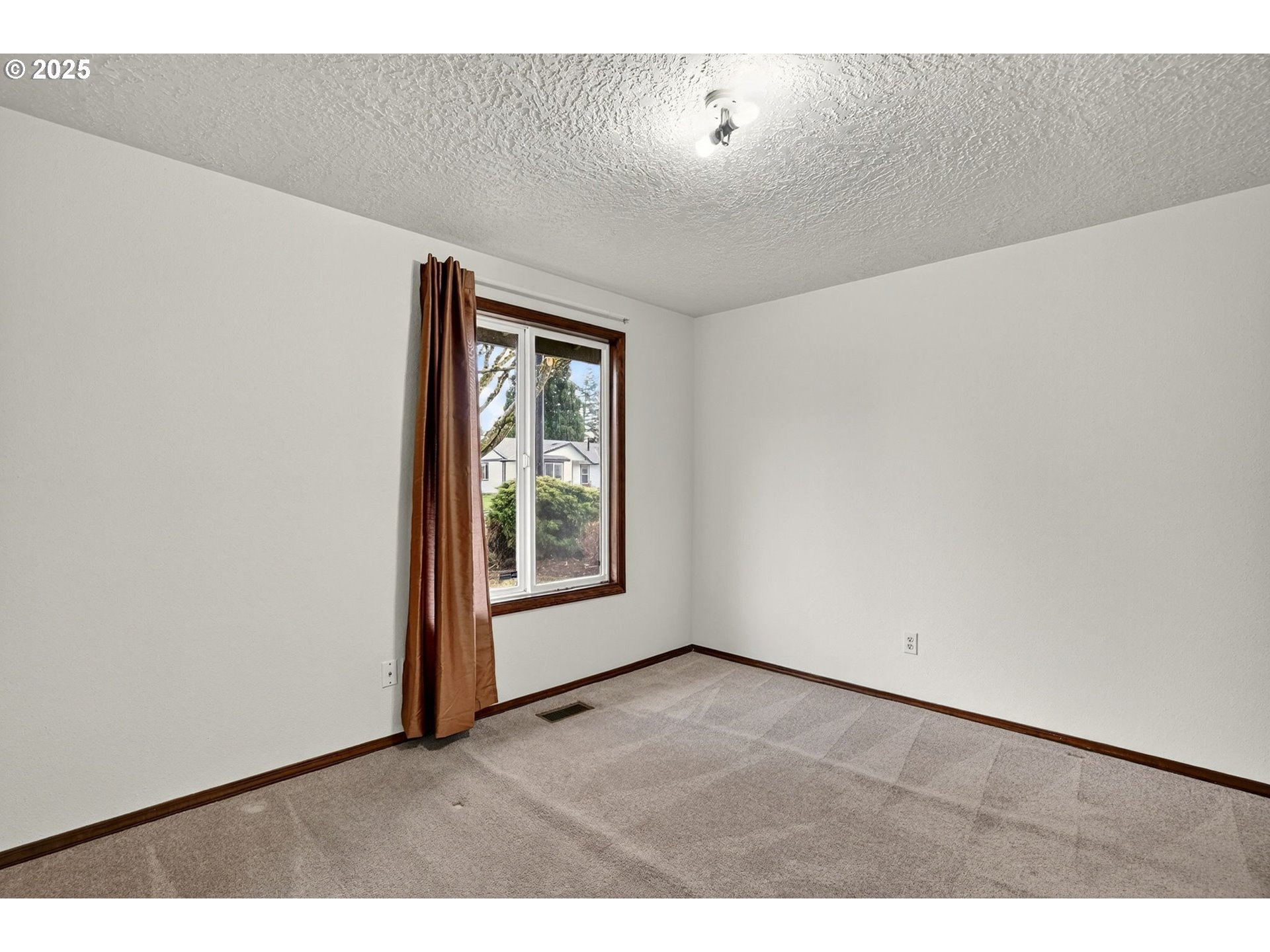 1427 Southeast Wendy Avenue Gresham, OR 97080 - Photo 20 of 35 a view of an empty room with a window