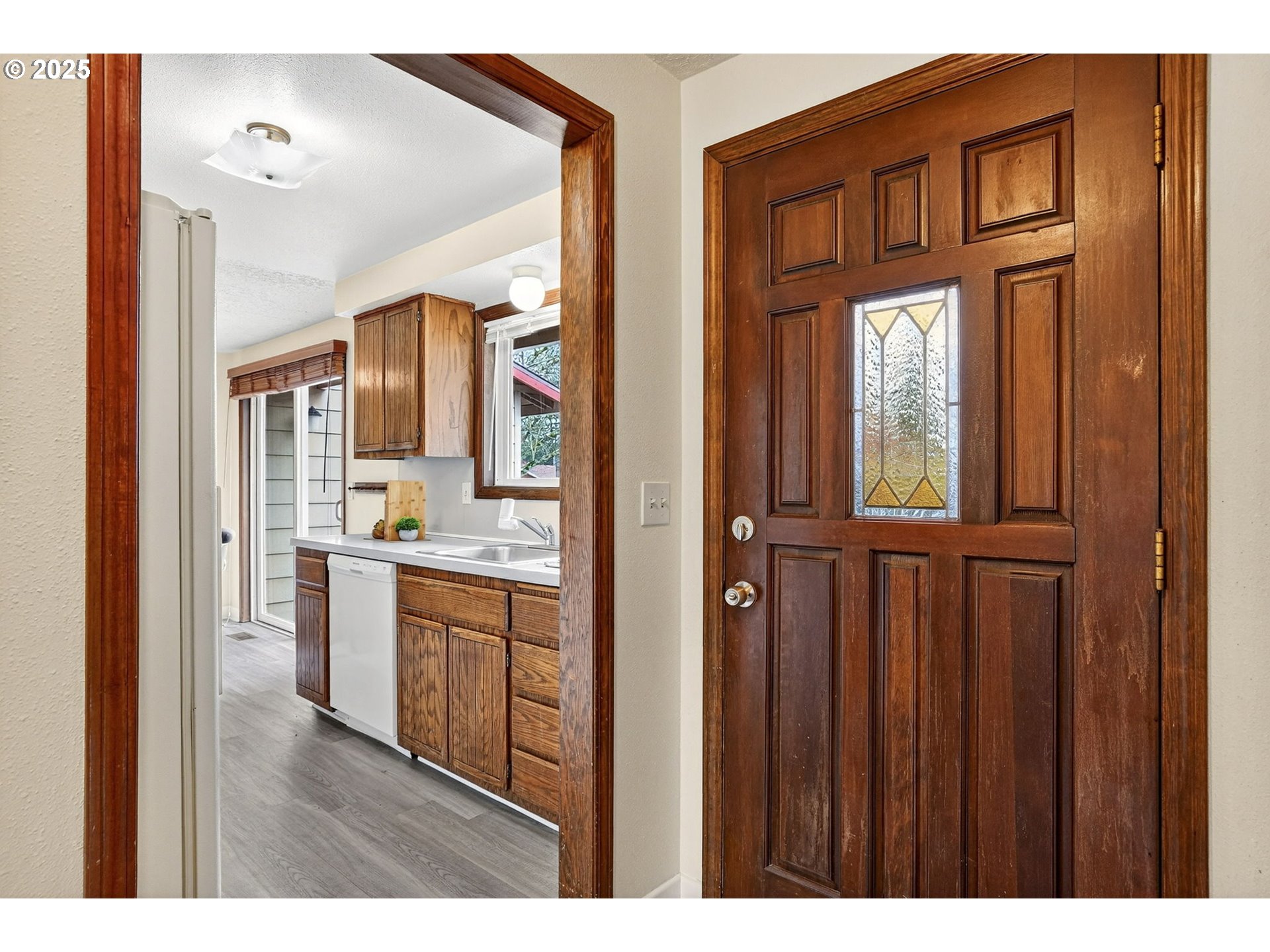 1427 Southeast Wendy Avenue Gresham, OR 97080 - Photo 6 of 35 a bathroom with a granite countertop sink a mirror and a vanity
