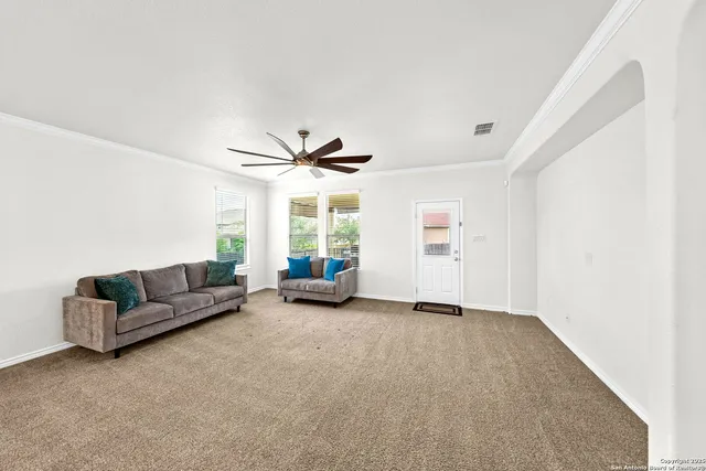 a living room with furniture and a window