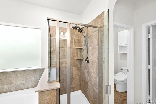 a bathroom with a shower and a tub