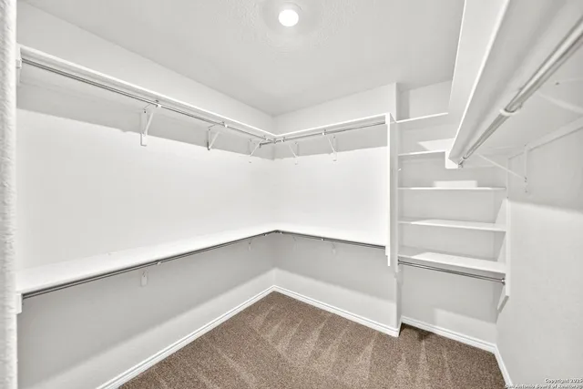 a view of an empty walk in closet