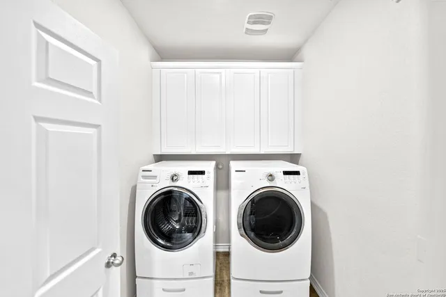 a utility room with dryer and washer