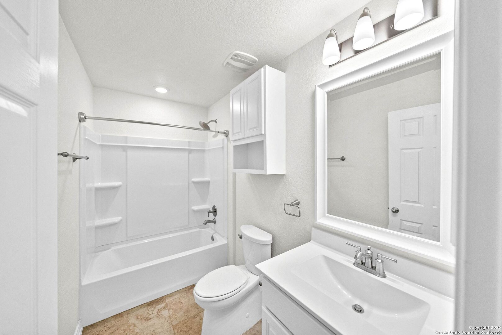 7621 Lorca Boerne, TX 78015 - Photo 35 of 46 a bathroom with a sink a toilet and a large mirror