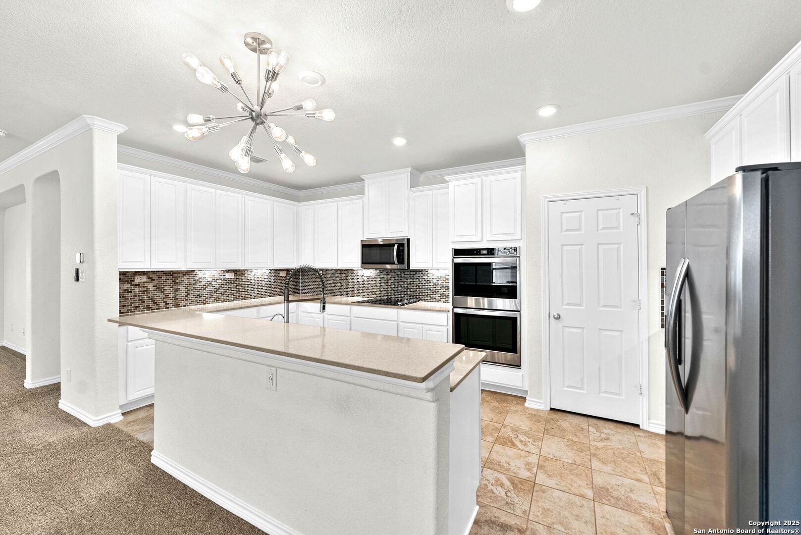 7621 Lorca Boerne, TX 78015 - Photo 5 of 46 a kitchen with stainless steel appliances granite countertop a refrigerator and a stove top oven