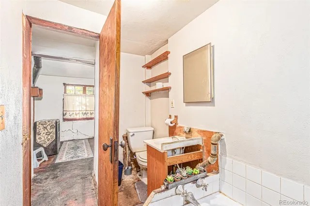 a bathroom with a sink mirror and a shower