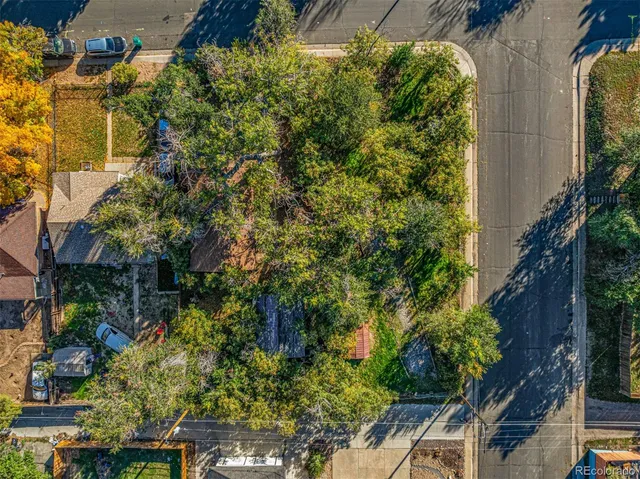 an aerial view of a house with a yard