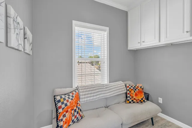 a view of a balcony with wooden floor