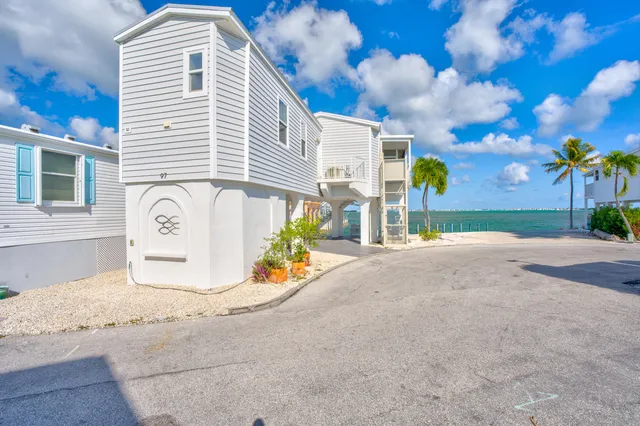 a aerial view of multiple houses with yard