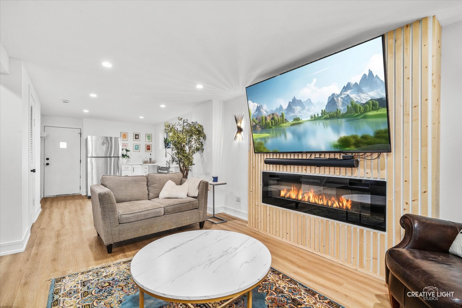 20 Forbes Road Riverside, IL 60546 - Photo 16 of 21 a living room with furniture a floor to ceiling window and a flat screen tv