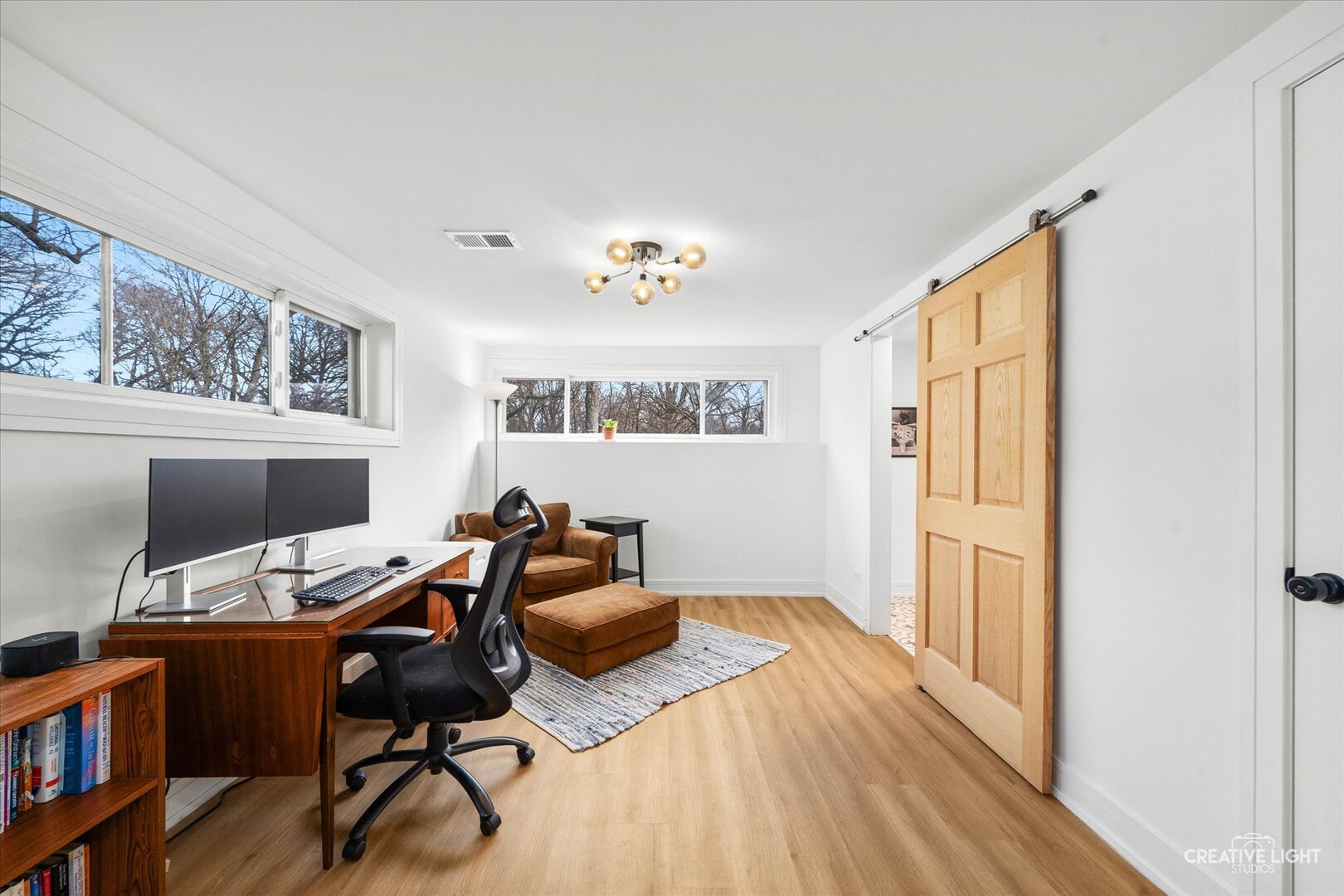20 Forbes Road Riverside, IL 60546 - Photo 18 of 21 a view of a workspace with furniture and a window