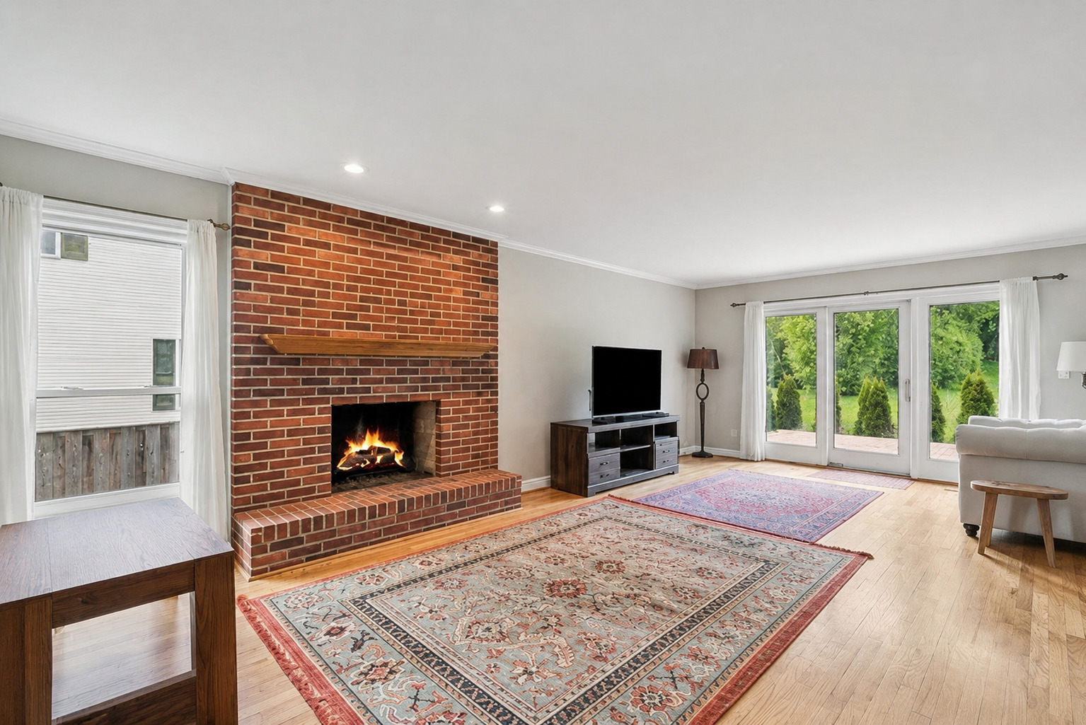 250 Wilshire Road Lake Forest, IL 60045 - Photo 10 of 28 a living room with furniture flat screen tv and a fireplace