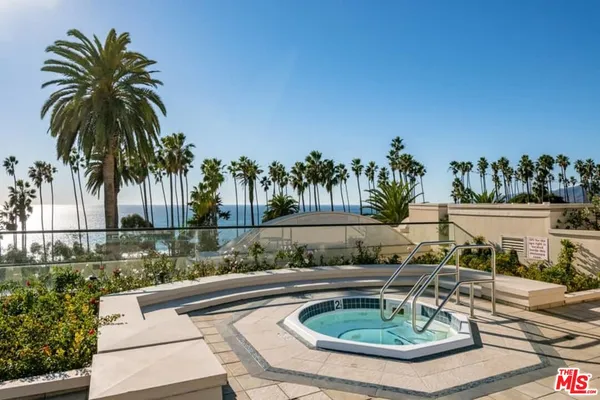 a swimming pool with outdoor seating and yard