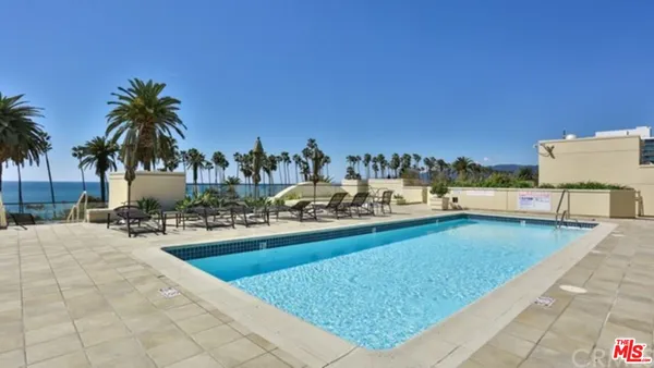 a view of a swimming pool and a chair