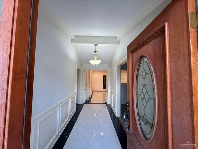 a view of a hallway with windows