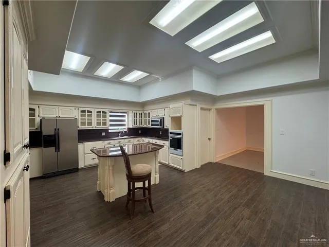 a kitchen with a table and chairs in it