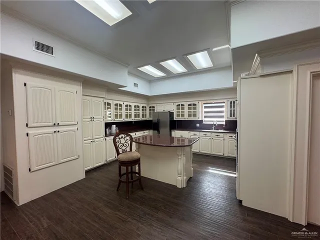 a kitchen with sink and cabinets