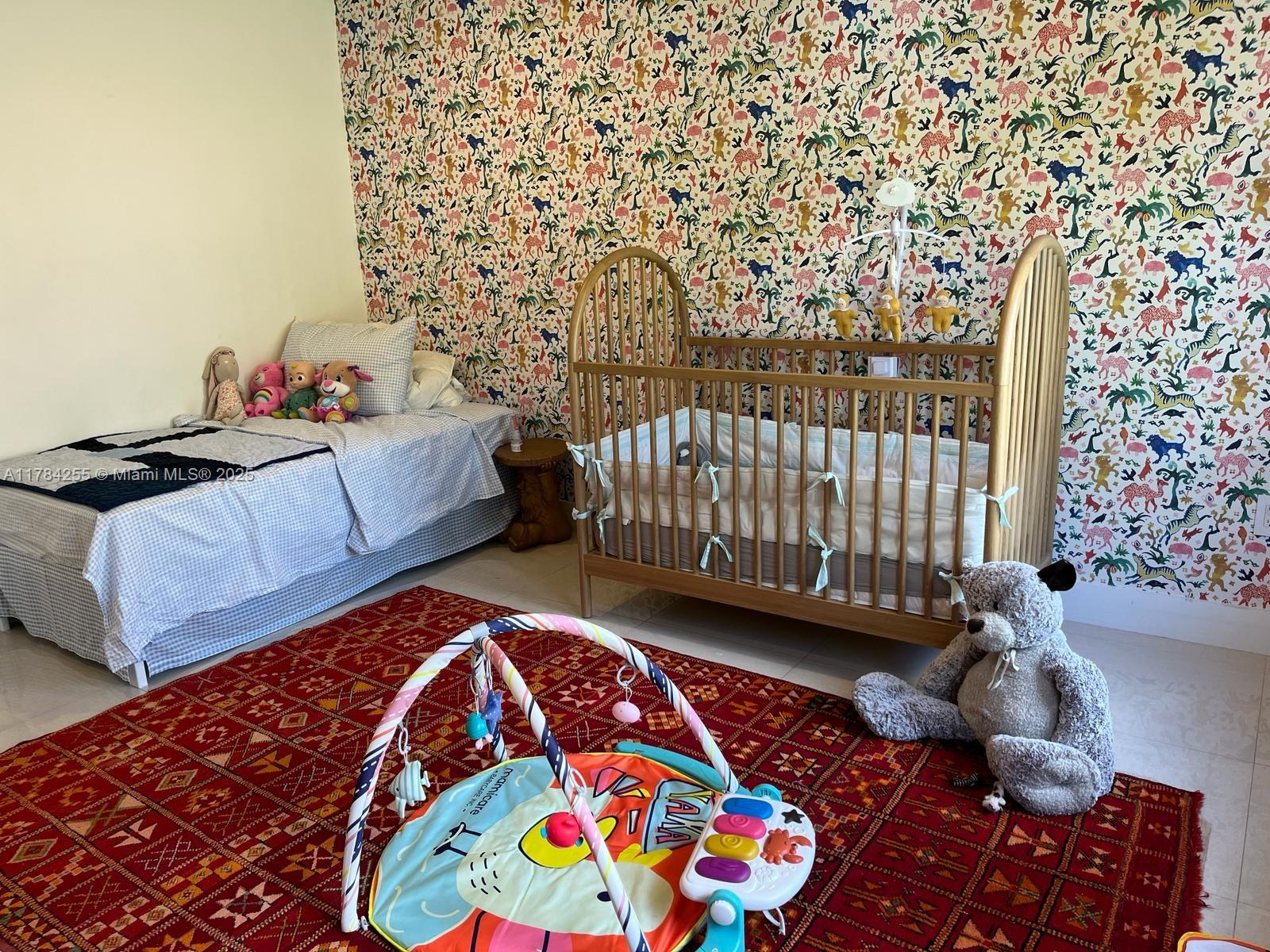 Tropical Isle Homes Key Biscayne, FL 33149 - Photo 16 of 38 a bedroom with a bed and a window