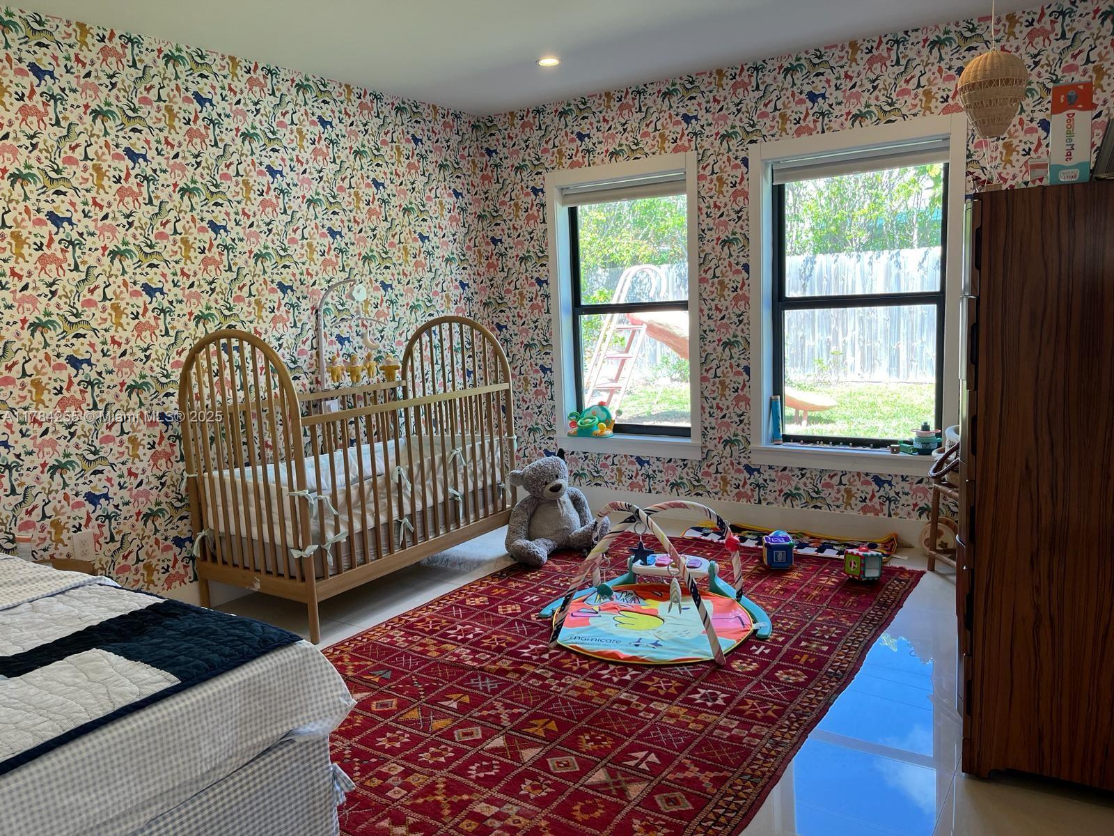 Tropical Isle Homes Key Biscayne, FL 33149 - Photo 19 of 38 a living room with a couch and a table