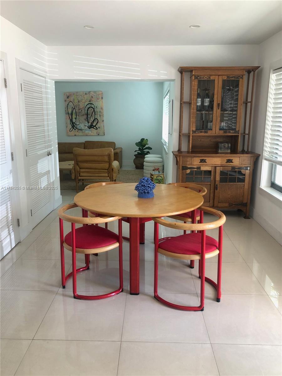 Tropical Isle Homes Key Biscayne, FL 33149 - Photo 37 of 38 a view of a dining room with furniture