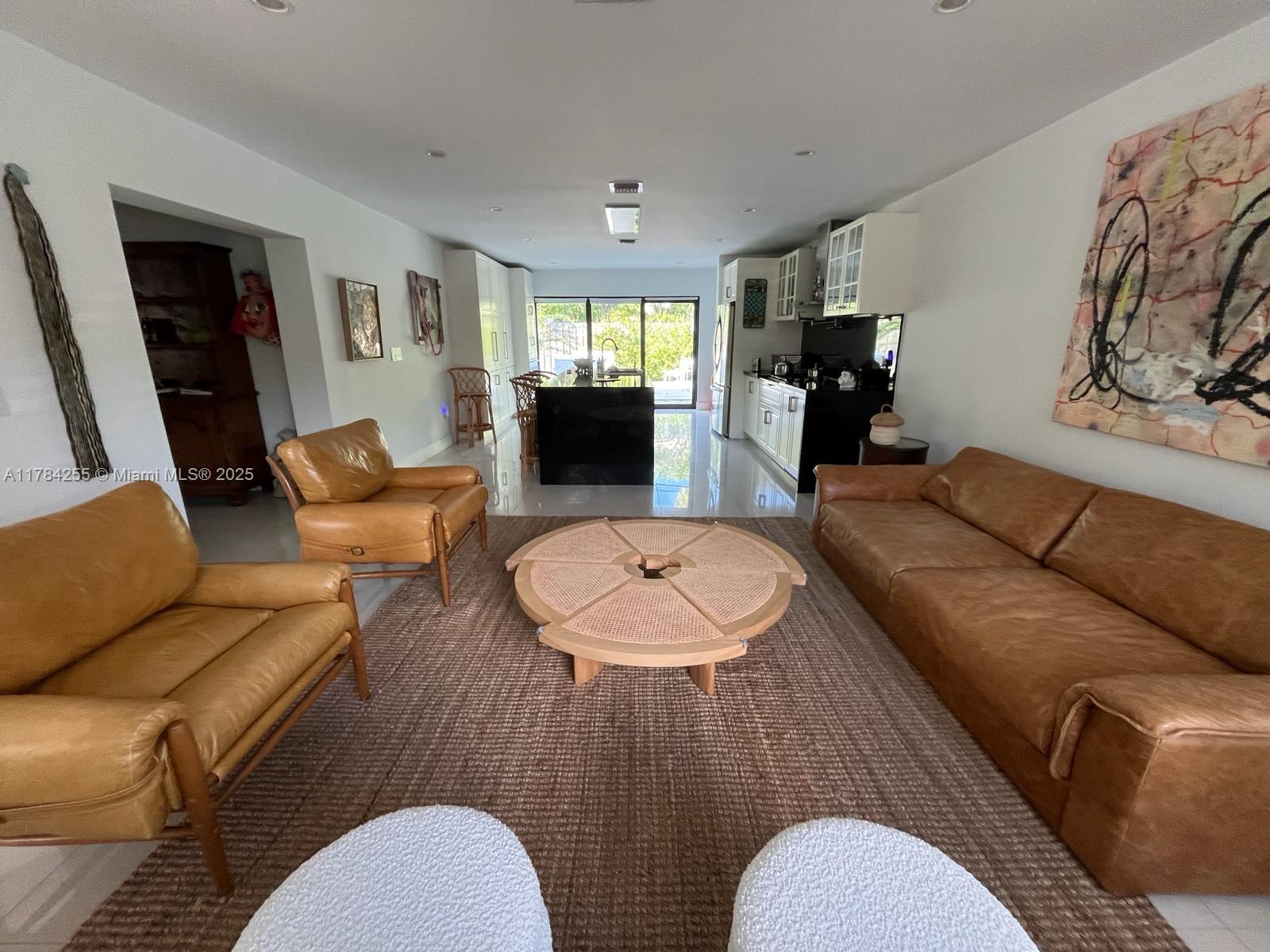 Tropical Isle Homes Key Biscayne, FL 33149 - Photo 5 of 38 a living room with furniture and wooden floor