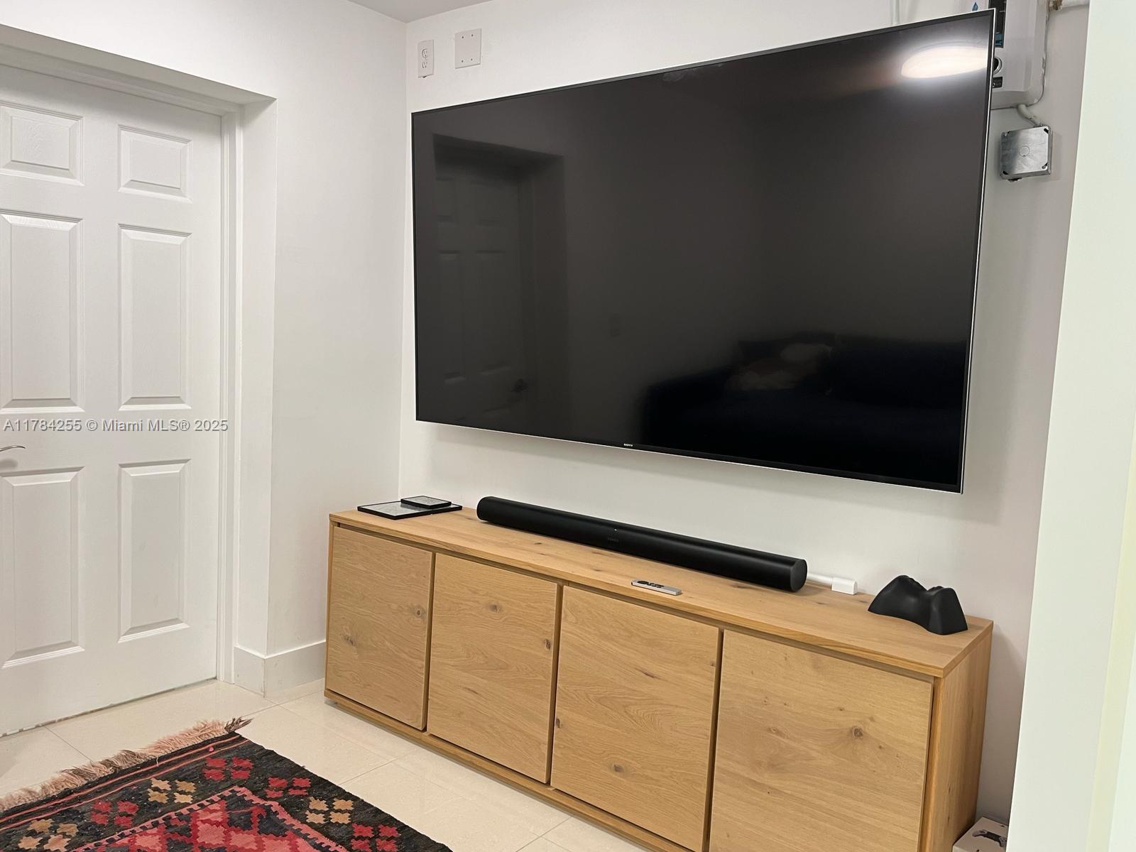Tropical Isle Homes Key Biscayne, FL 33149 - Photo 10 of 38 a kitchen with a sink and cabinets