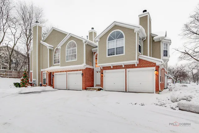 a view of a house with a snow in the yard
