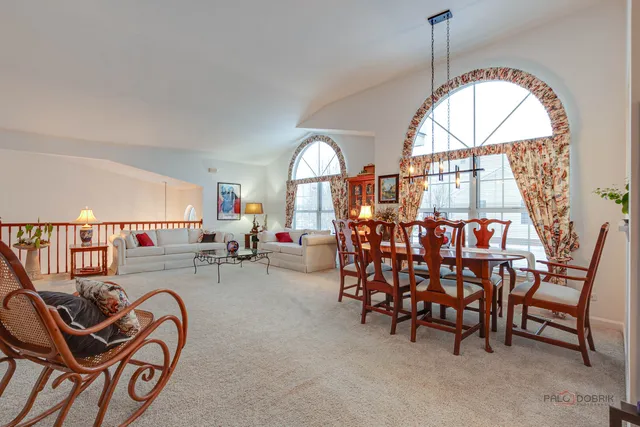 a view of a livingroom with furniture and a window