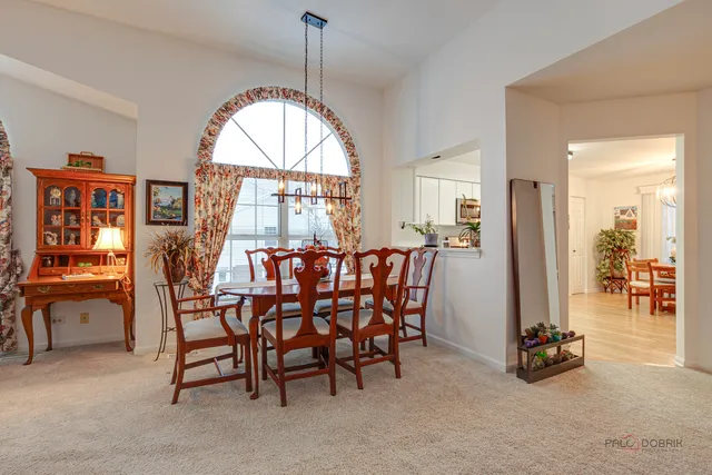 a view of a livingroom with furniture and a table