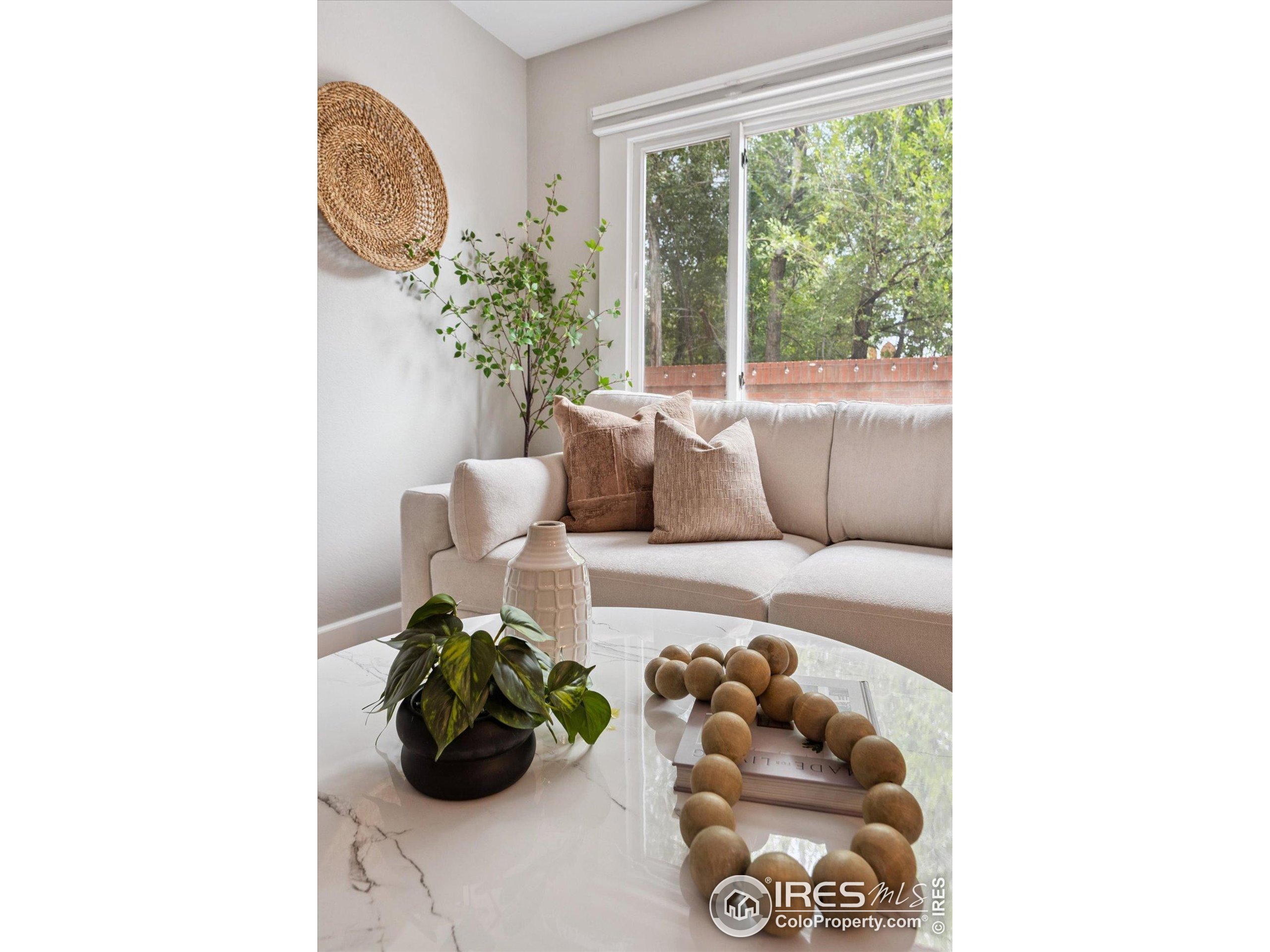 2201 Pearl Street, Unit 2 Boulder, CO 80302 - Photo 15 of 37 a living room with furniture and flower plants