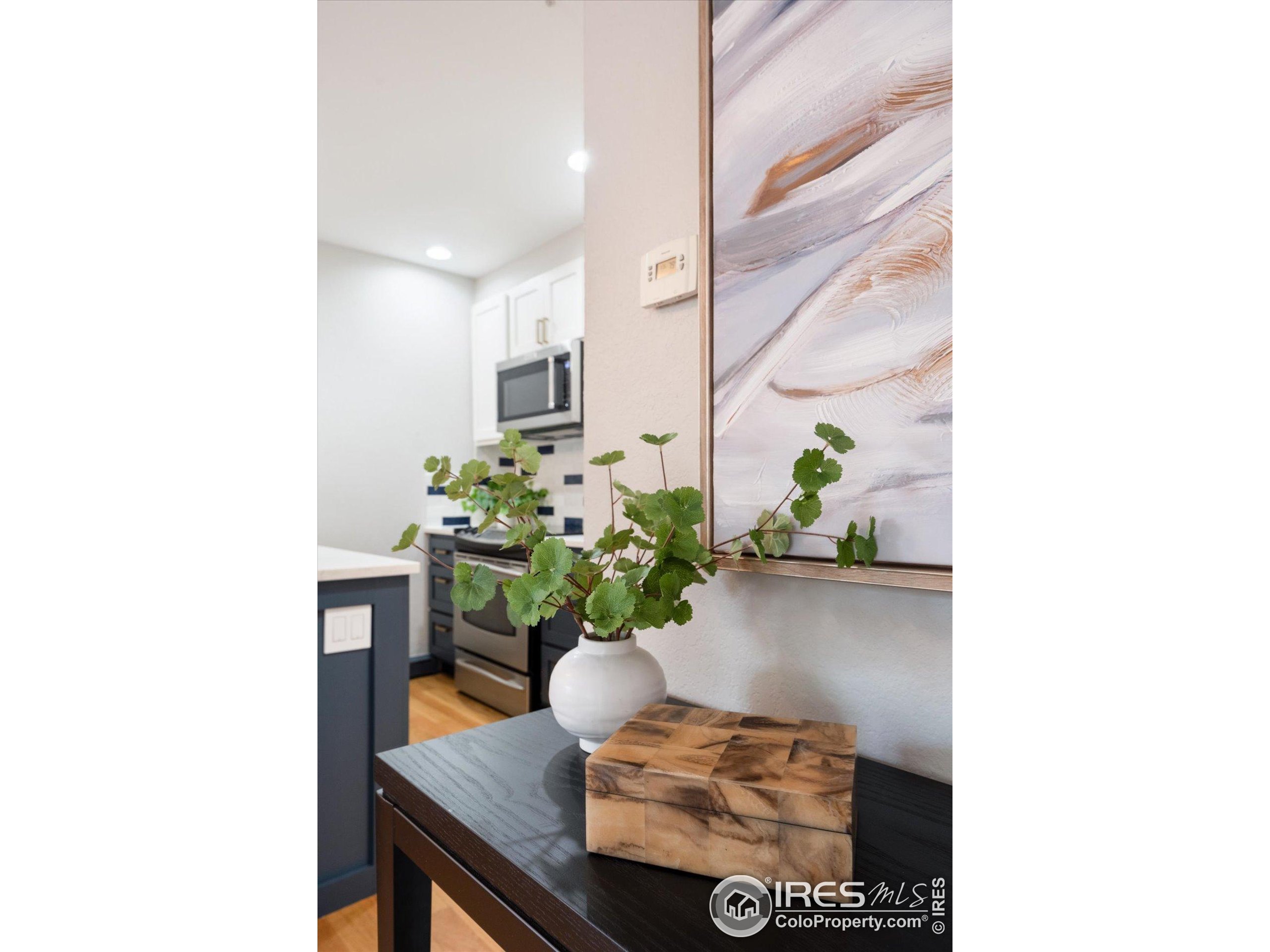 2201 Pearl Street, Unit 2 Boulder, CO 80302 - Photo 17 of 37 a living room with furniture and a potted plant