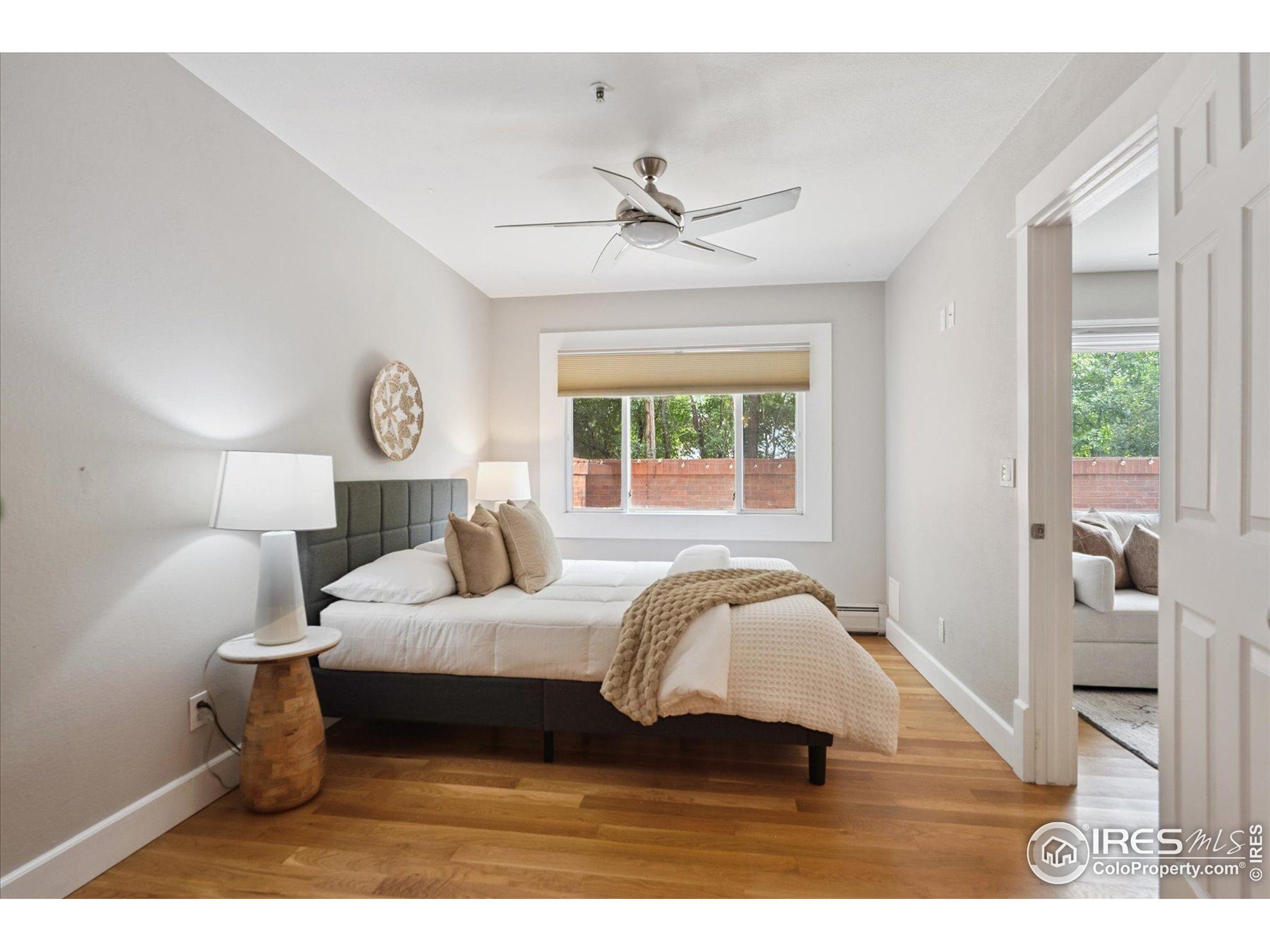 2201 Pearl Street, Unit 2 Boulder, CO 80302 - Photo 20 of 37 a bedroom with a bed and a large mirror