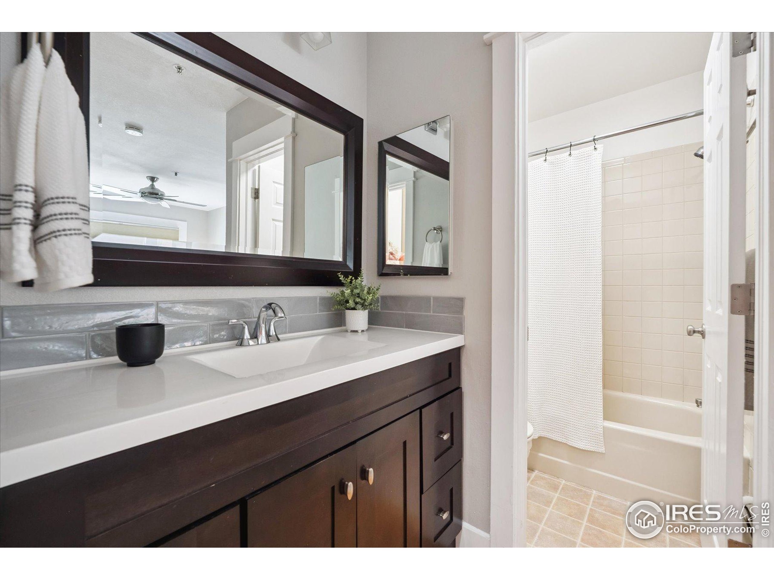 2201 Pearl Street, Unit 2 Boulder, CO 80302 - Photo 23 of 37 a bathroom with a sink and a mirror
