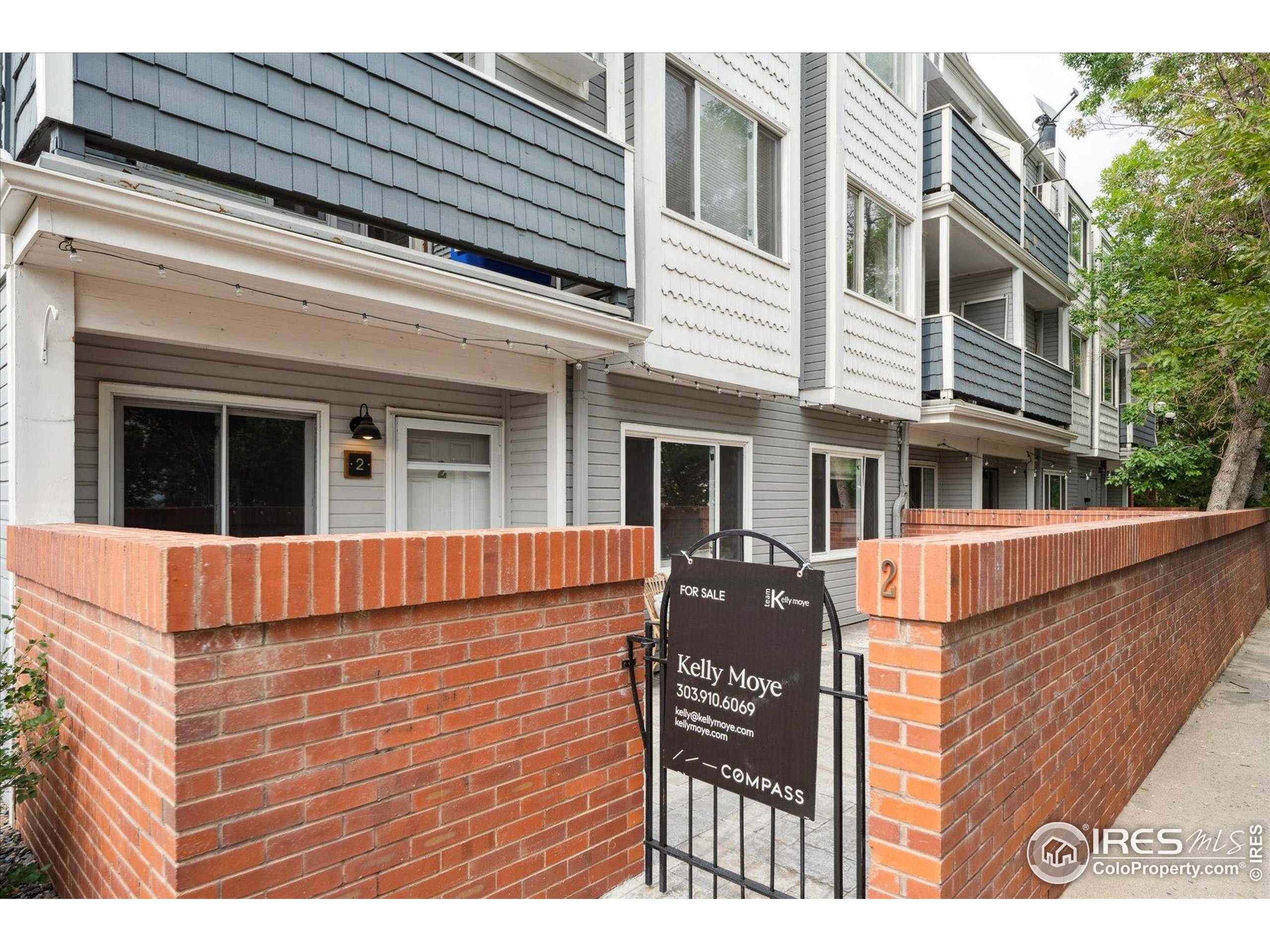 2201 Pearl Street, Unit 2 Boulder, CO 80302 - Photo 4 of 37 a view of brick house with large windows