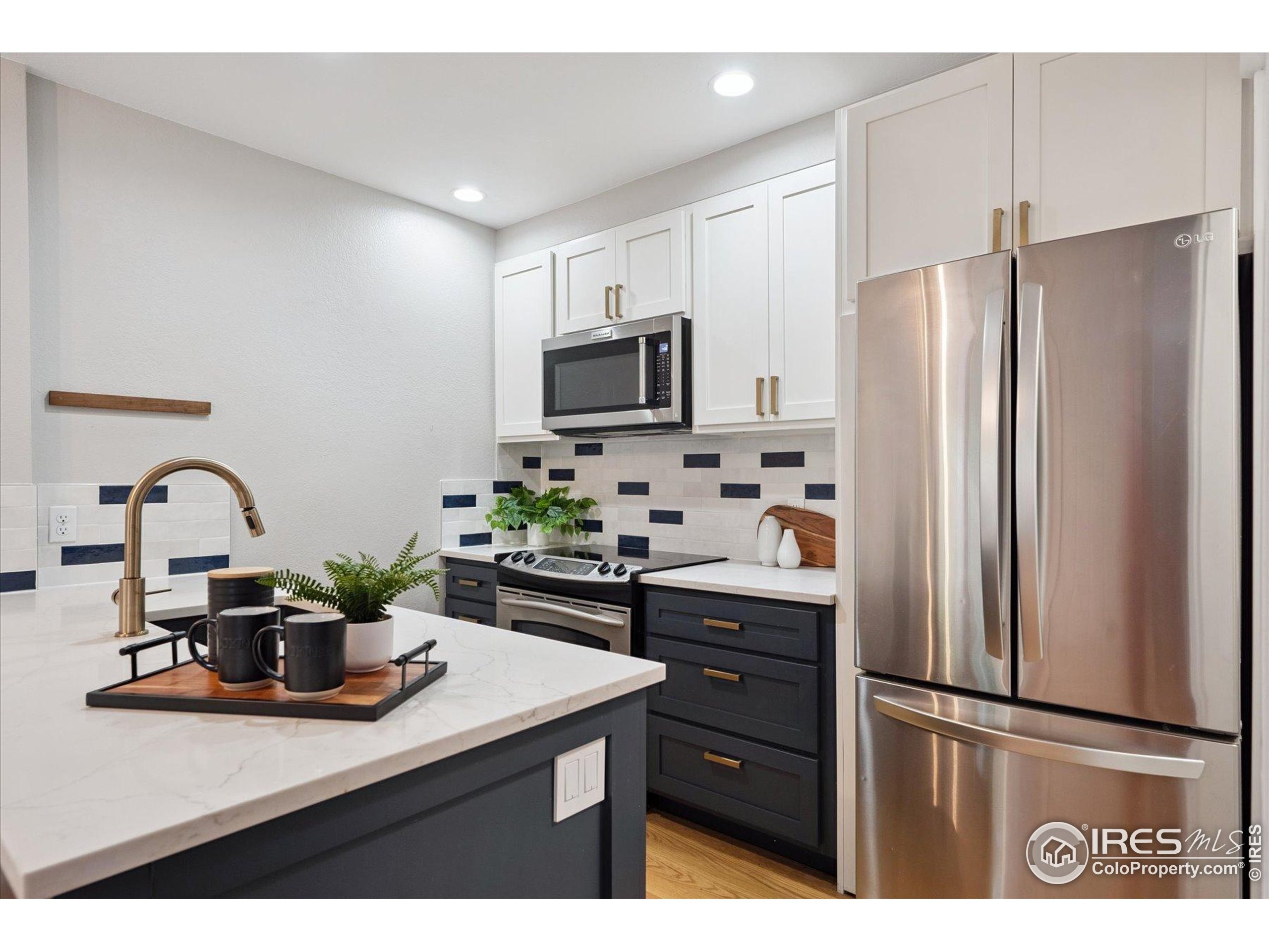 2201 Pearl Street, Unit 2 Boulder, CO 80302 - Photo 6 of 37 a kitchen with stainless steel appliances a sink cabinets and a counter top space