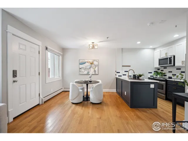a kitchen with a refrigerator and a sink