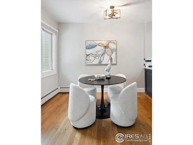 a glass table sitting next to a white wall