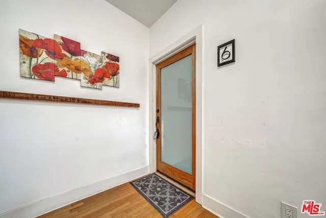 a view of front door of house with stairs