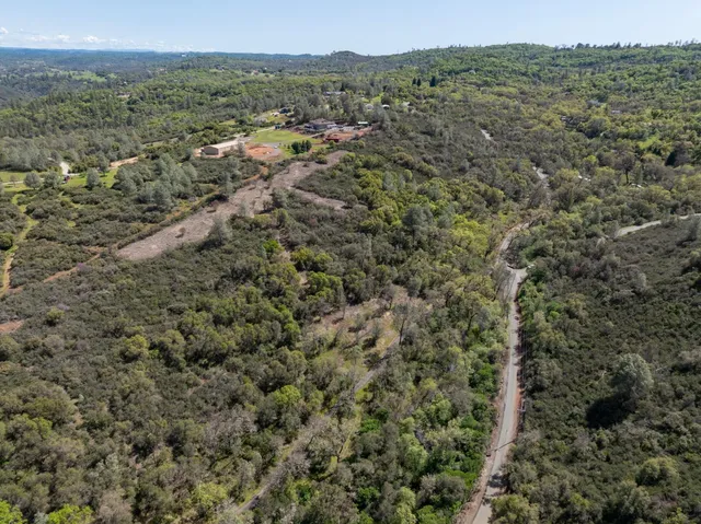a view of a field with an ocean view