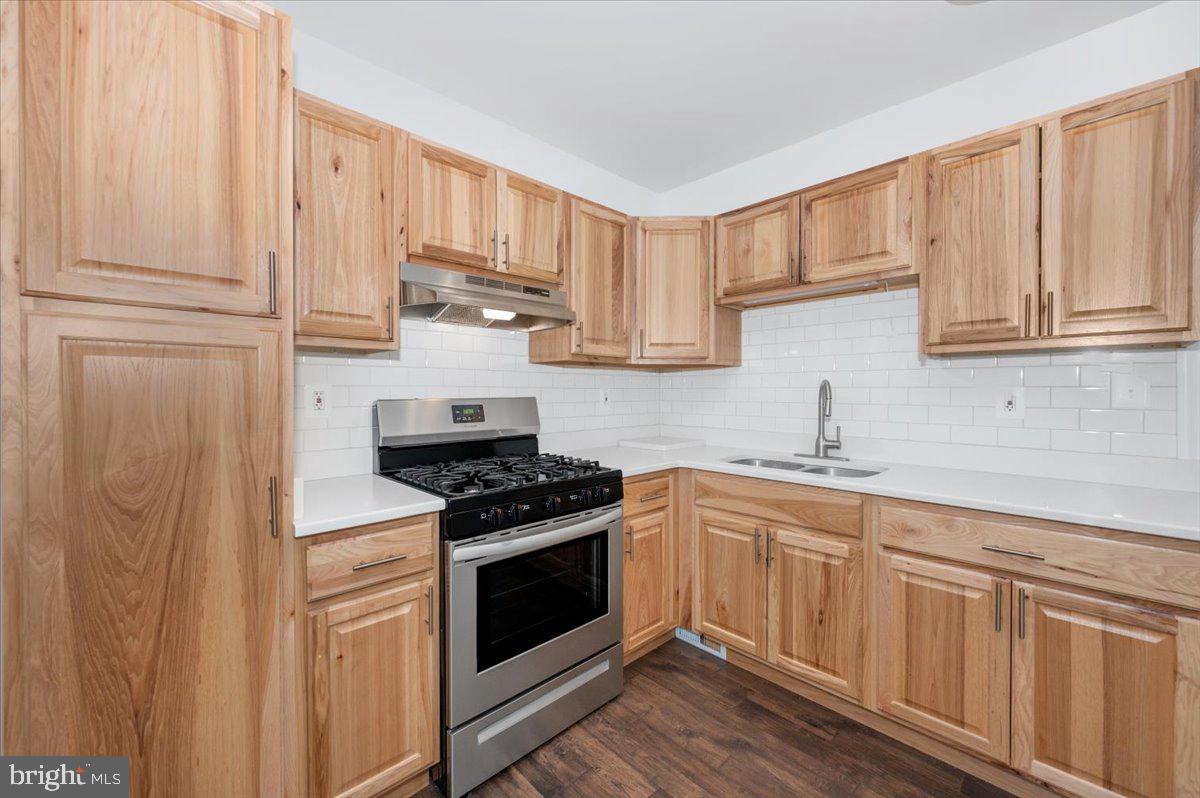 1910 Tyler Road Dundalk, MD 21222 - Photo 18 of 58 Modern kitchen with natural wood accents.