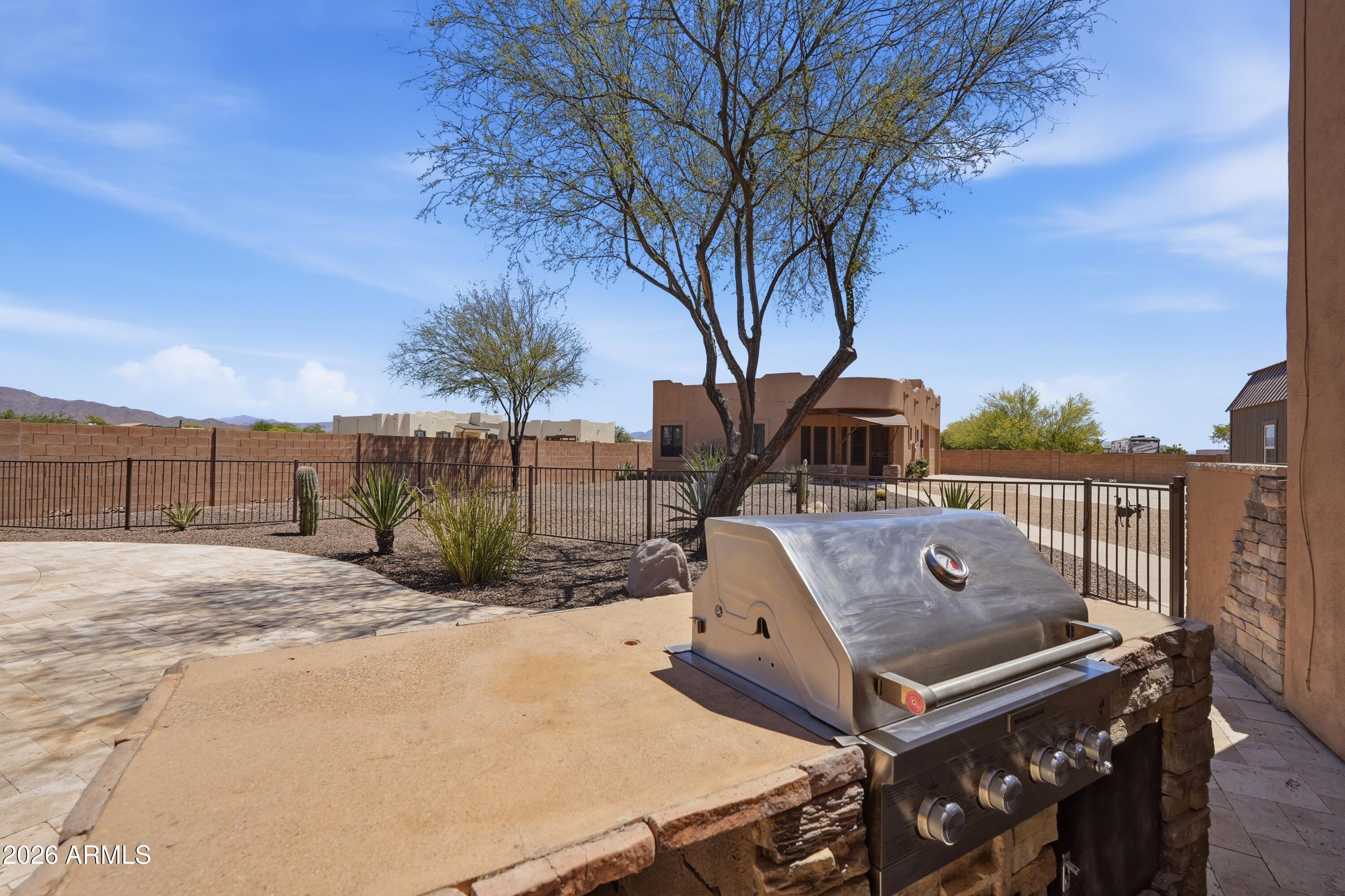 2616 West Canyon Road Phoenix, AZ 85086 - Photo 31 of 45 a view of a terrace with wooden fence