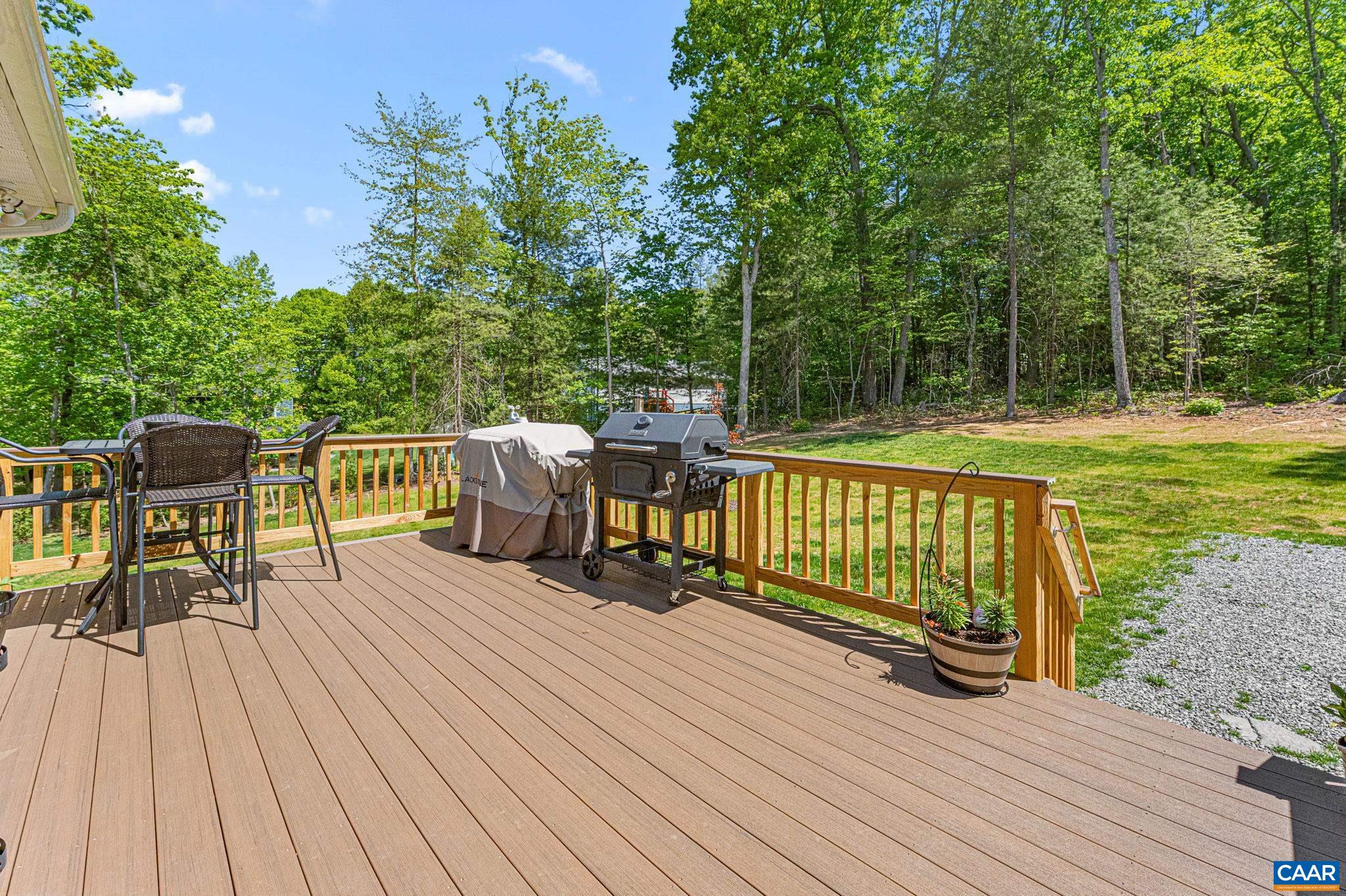 230 Fox Hollow Road Ruckersville, VA 22968 - Photo 16 of 42 a view of a deck with chairs and wooden floor